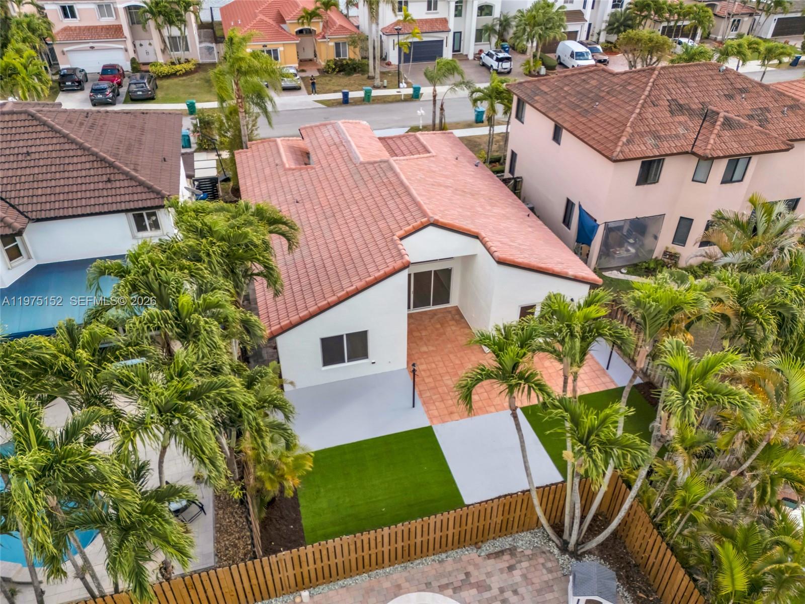 16333 Southwest 68th Terrace Miami, FL 33193 - Photo 29 of 32 an aerial view of multiple houses with yard