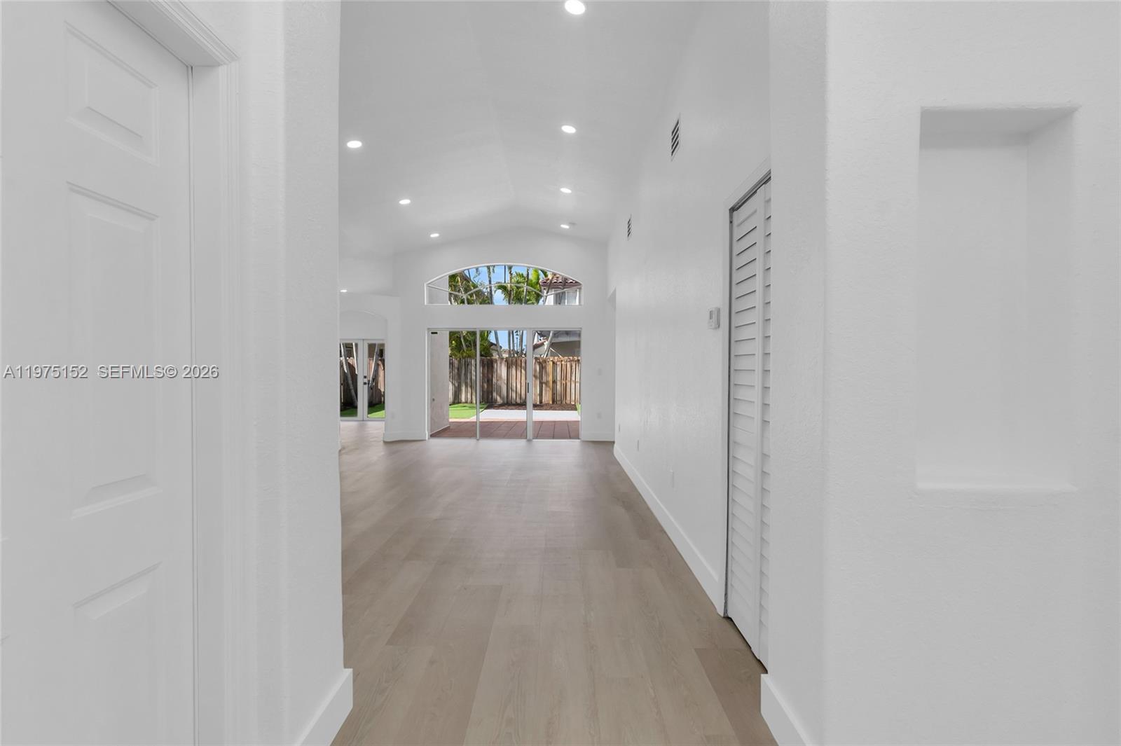 16333 Southwest 68th Terrace Miami, FL 33193 - Photo 7 of 32 a view of hallway with wooden floor