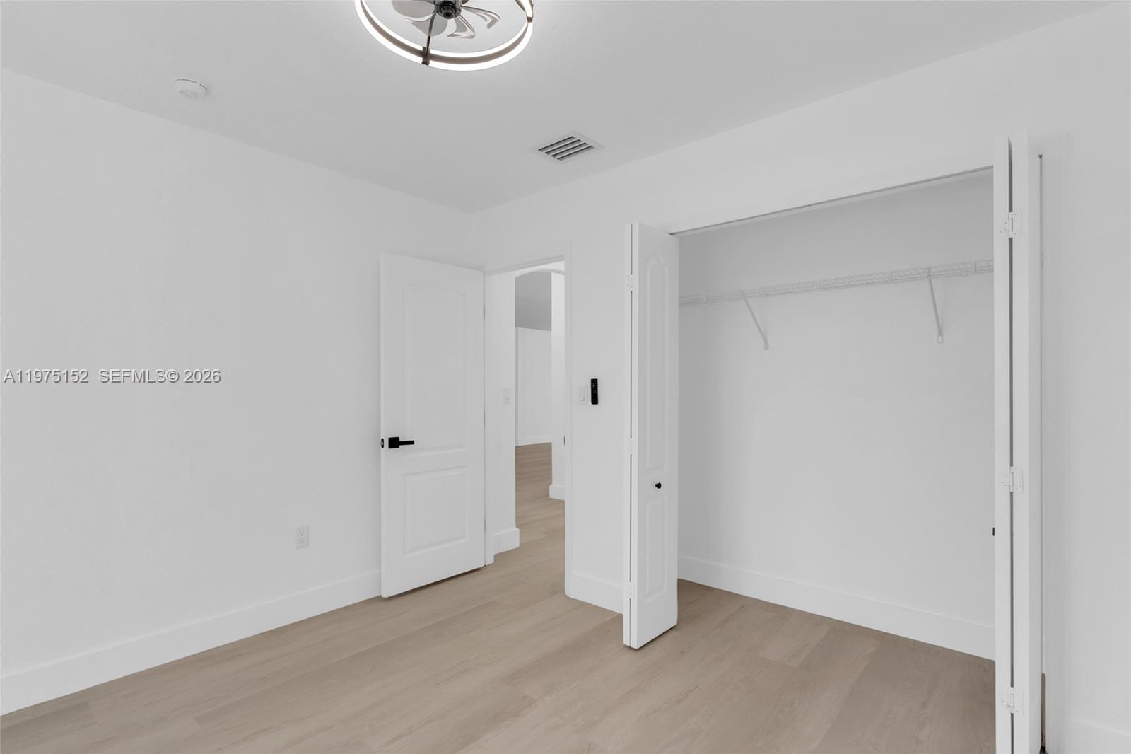 16333 Southwest 68th Terrace Miami, FL 33193 - Photo 9 of 32 a view of an empty room