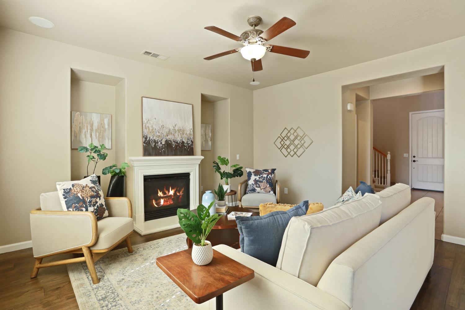 5948 Pebblestone Way Stockton, CA 95219 - Photo 11 of 46 a living room with furniture a fireplace and a potted plant
