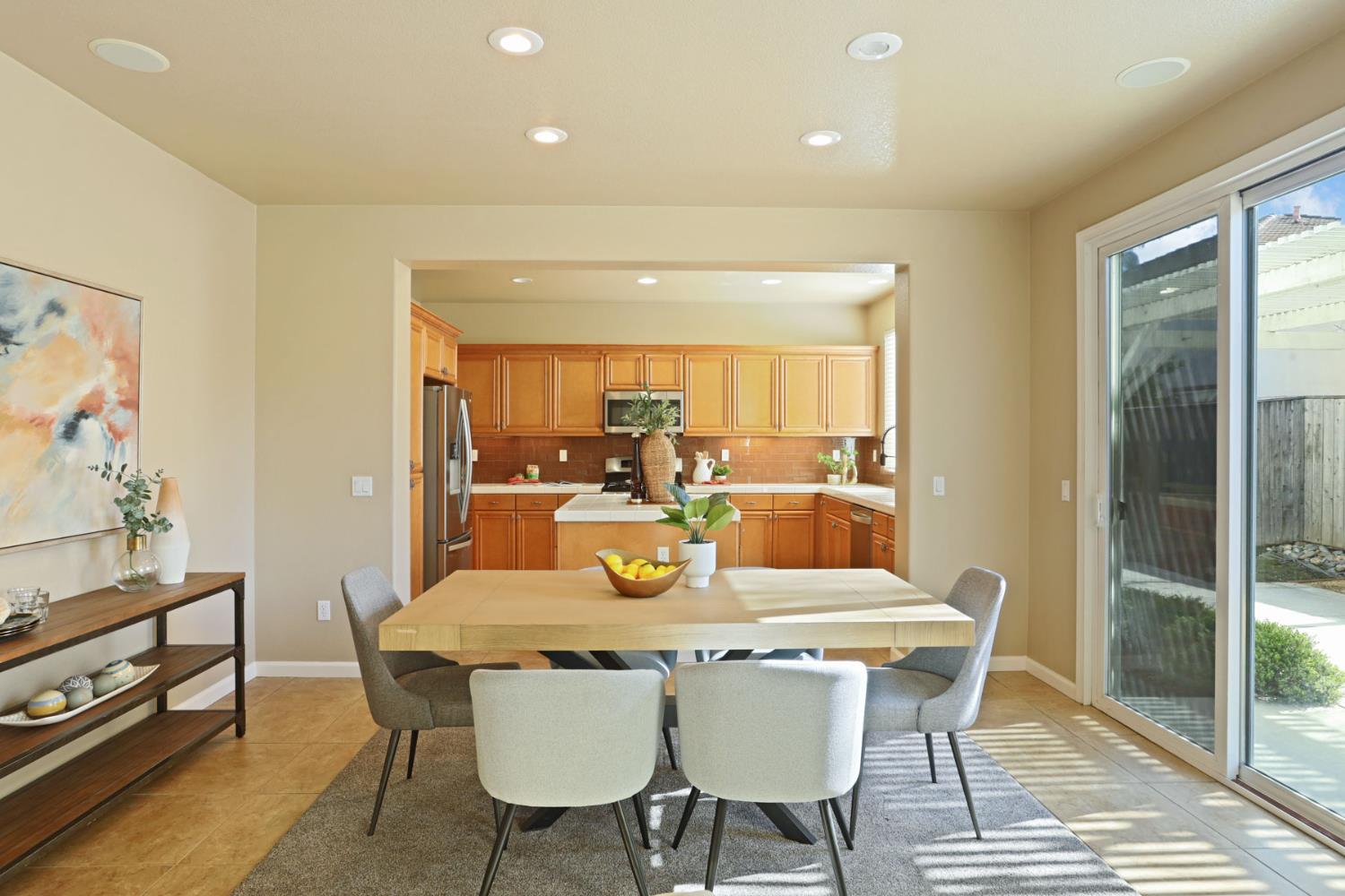 5948 Pebblestone Way Stockton, CA 95219 - Photo 13 of 46 a view of a dining room with furniture window and wooden floor