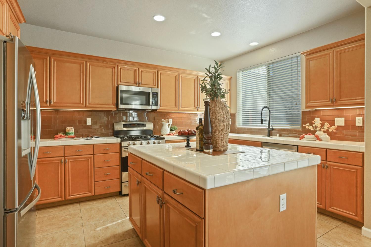 5948 Pebblestone Way Stockton, CA 95219 - Photo 15 of 46 a kitchen with cabinets appliances and a sink