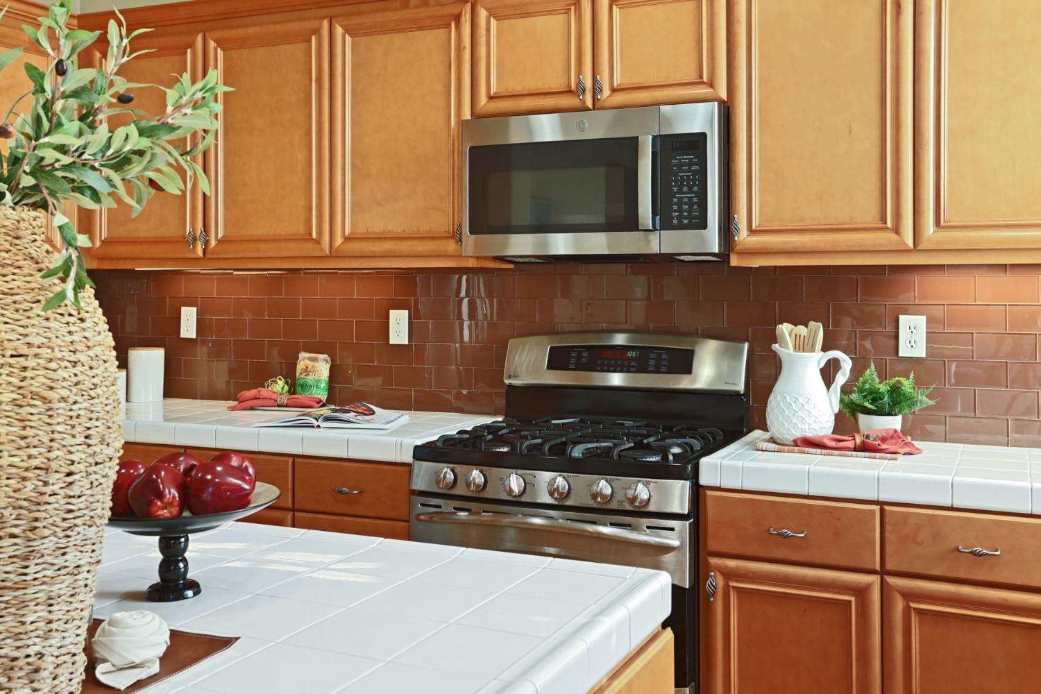 5948 Pebblestone Way Stockton, CA 95219 - Photo 17 of 46 a kitchen with a sink a stove and cabinets