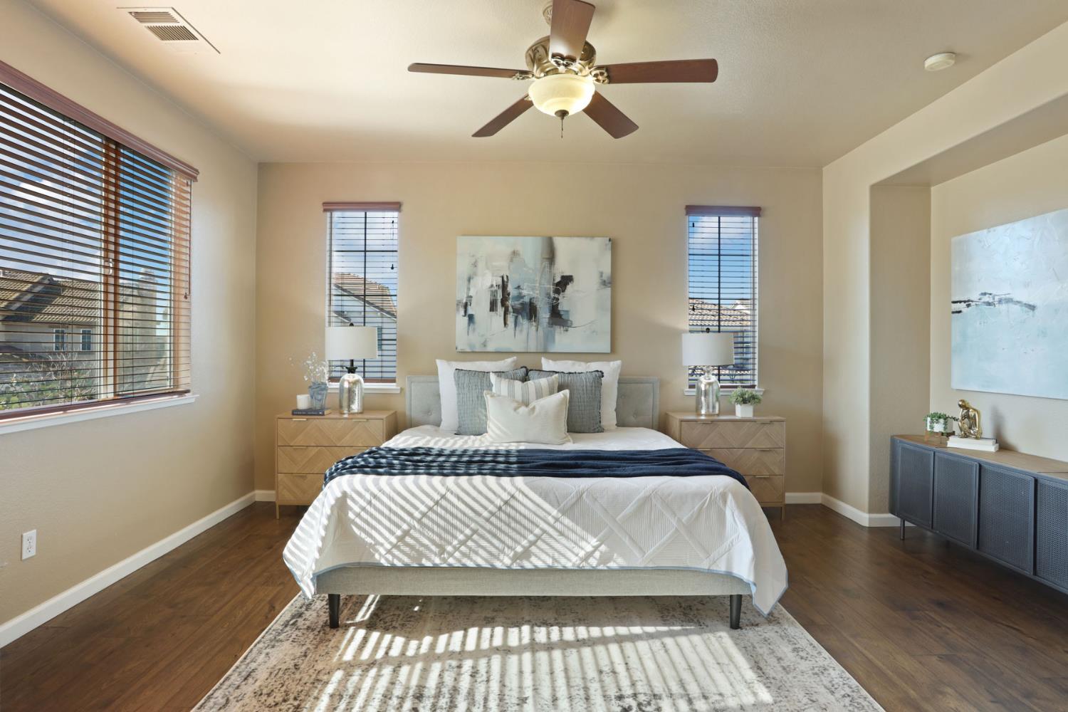 5948 Pebblestone Way Stockton, CA 95219 - Photo 31 of 46 a bedroom with a large bed and a chandelier