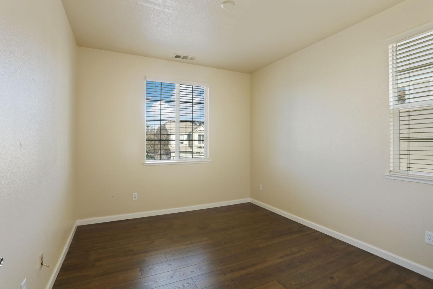 5948 Pebblestone Way Stockton, CA 95219 - Photo 38 of 46 wooden floor in an empty room with a window