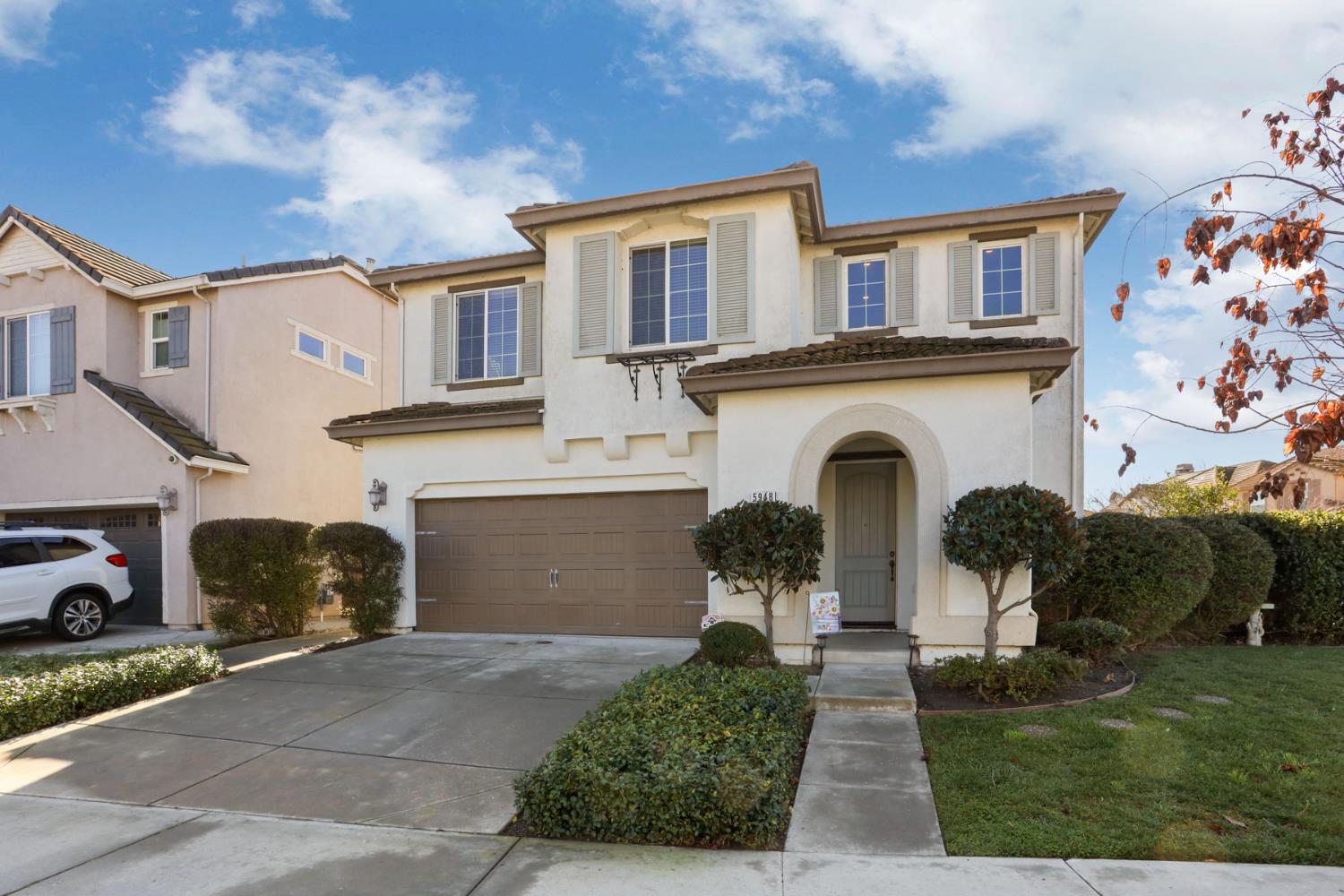 5948 Pebblestone Way Stockton, CA 95219 - Photo 4 of 46 a front view of a house with garden