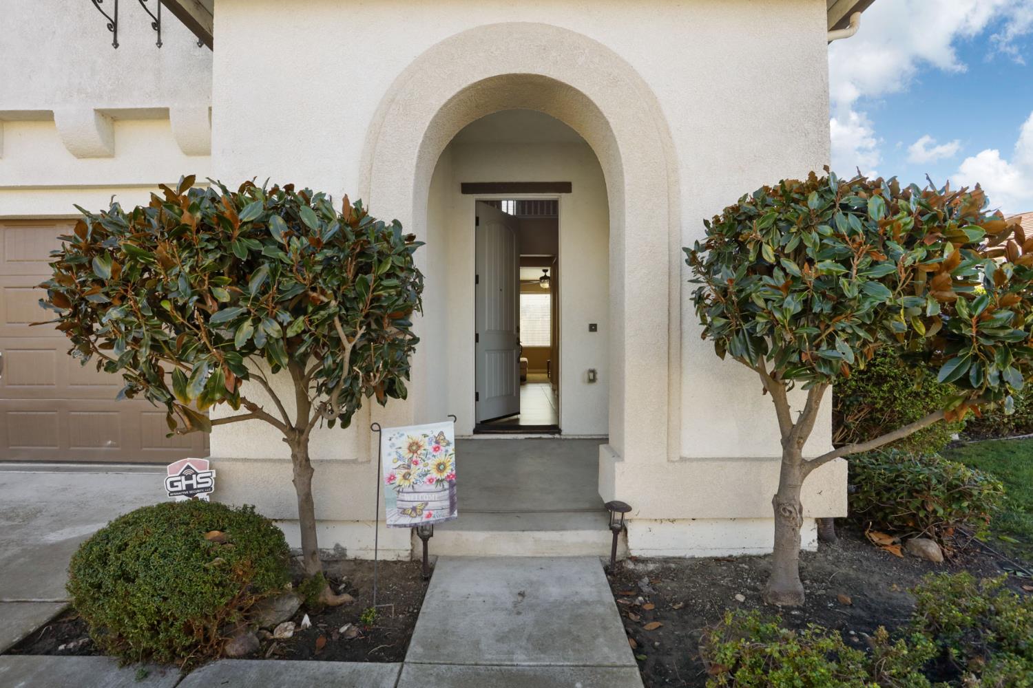 5948 Pebblestone Way Stockton, CA 95219 - Photo 5 of 46 a front view of a house with a garden