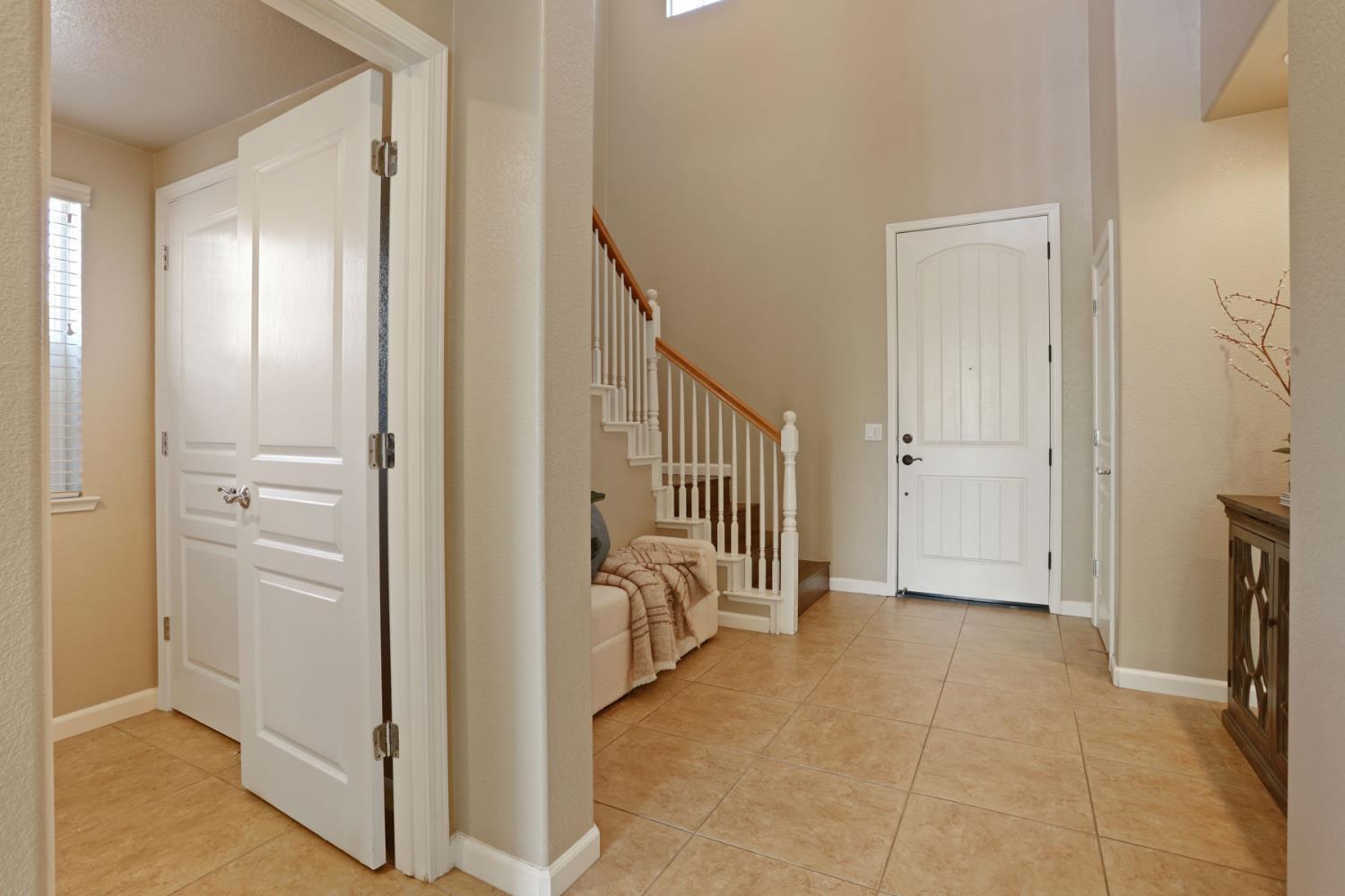 5948 Pebblestone Way Stockton, CA 95219 - Photo 8 of 46 a view of a hallway with closet and a livingroom view