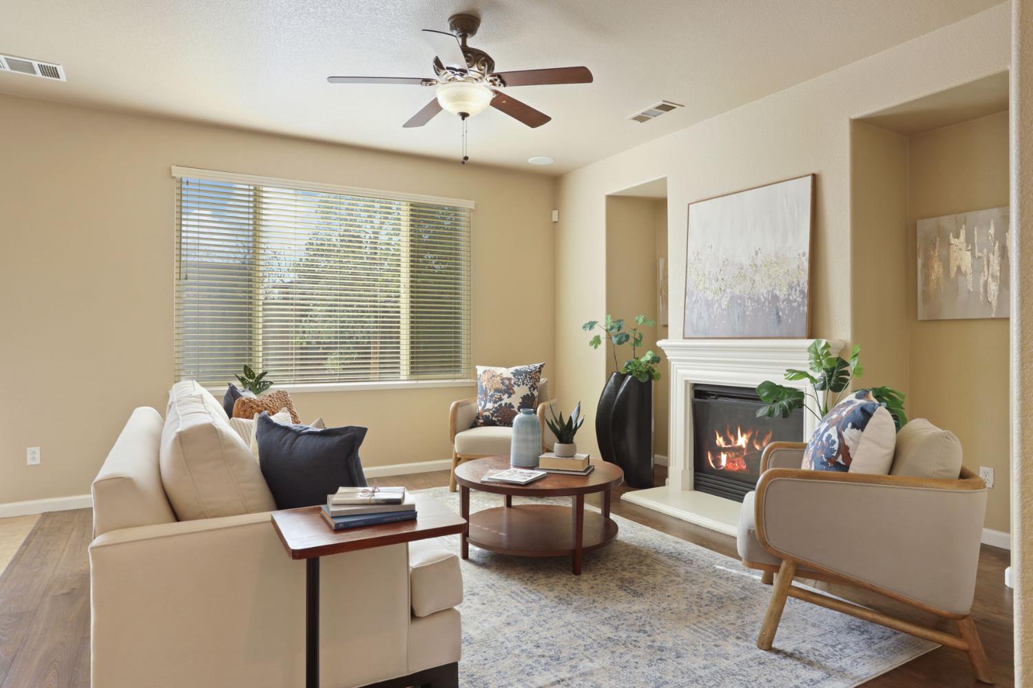 5948 Pebblestone Way Stockton, CA 95219 - Photo 10 of 46 a living room with furniture and a fireplace