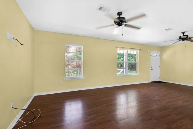 a view of an empty room with a window