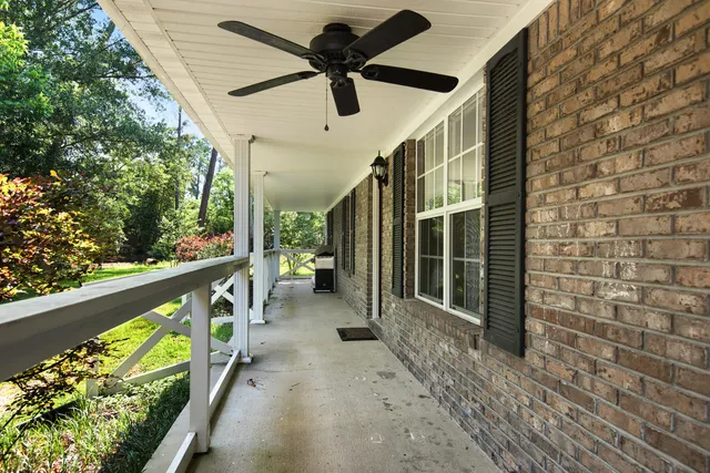 a view of a porch with wooden floor