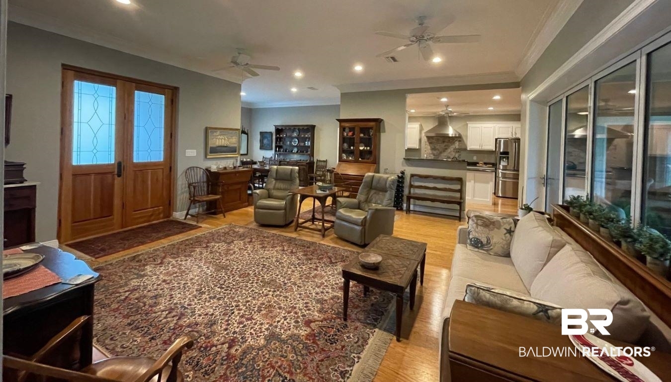 6426 East Quarry Drive Elberta, AL 36530 - Photo 3 of 19 Living room with crown molding, light wood-type flooring, and ceiling fan
