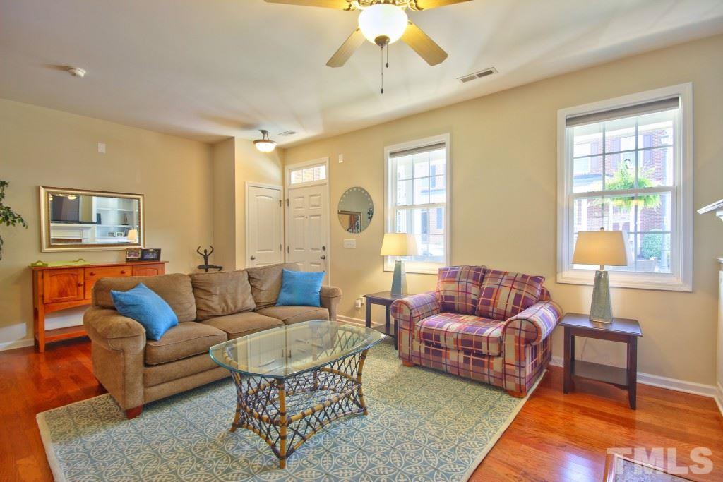 511 Dragby Lane Raleigh, NC 27603 - Photo 3 of 24 a living room with furniture wooden floor and a large window
