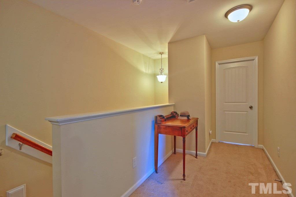 511 Dragby Lane Raleigh, NC 27603 - Photo 22 of 24 a view of a hallway with chairs
