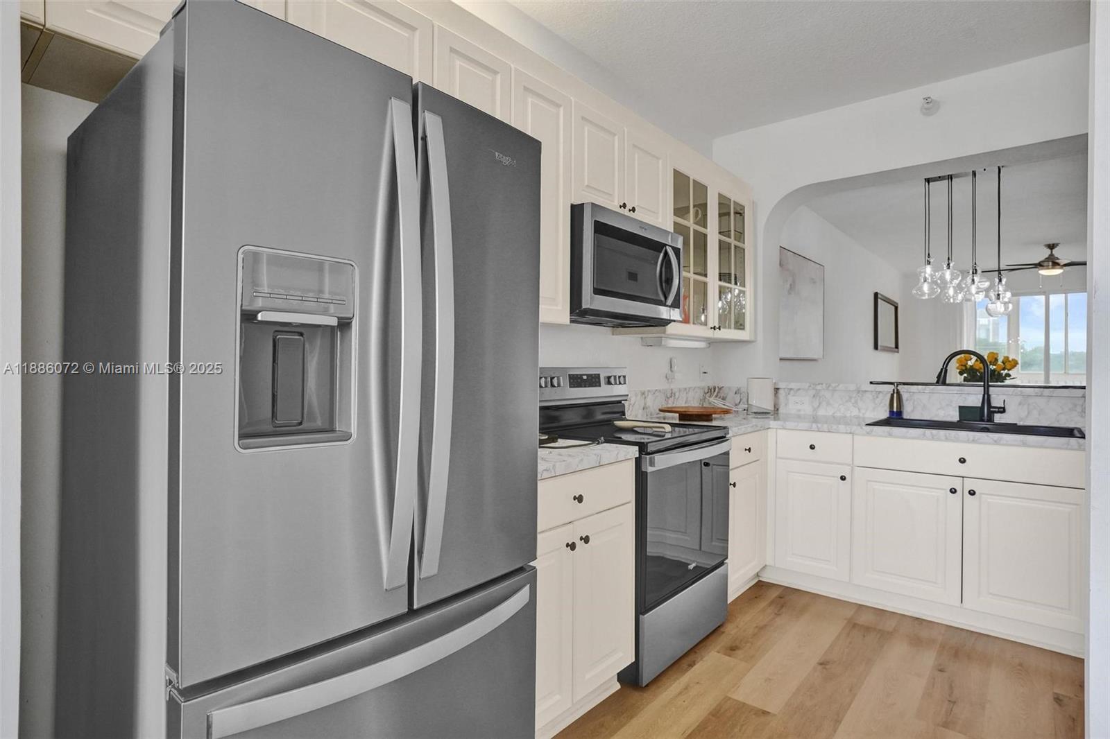 7635 Southampton Terrace, Unit 307 Tamarac, FL 33321 - Photo 12 of 43 a kitchen with cabinets stainless steel appliances and a counter space