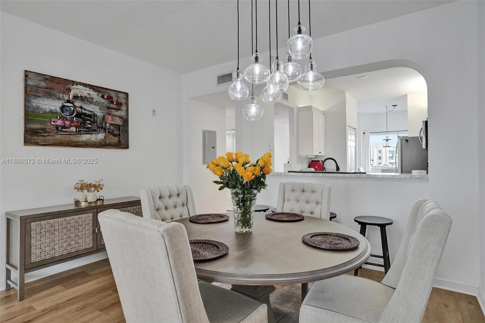 7635 Southampton Terrace, Unit 307 Tamarac, FL 33321 - Photo 19 of 43 a view of a dining room with furniture and chandelier