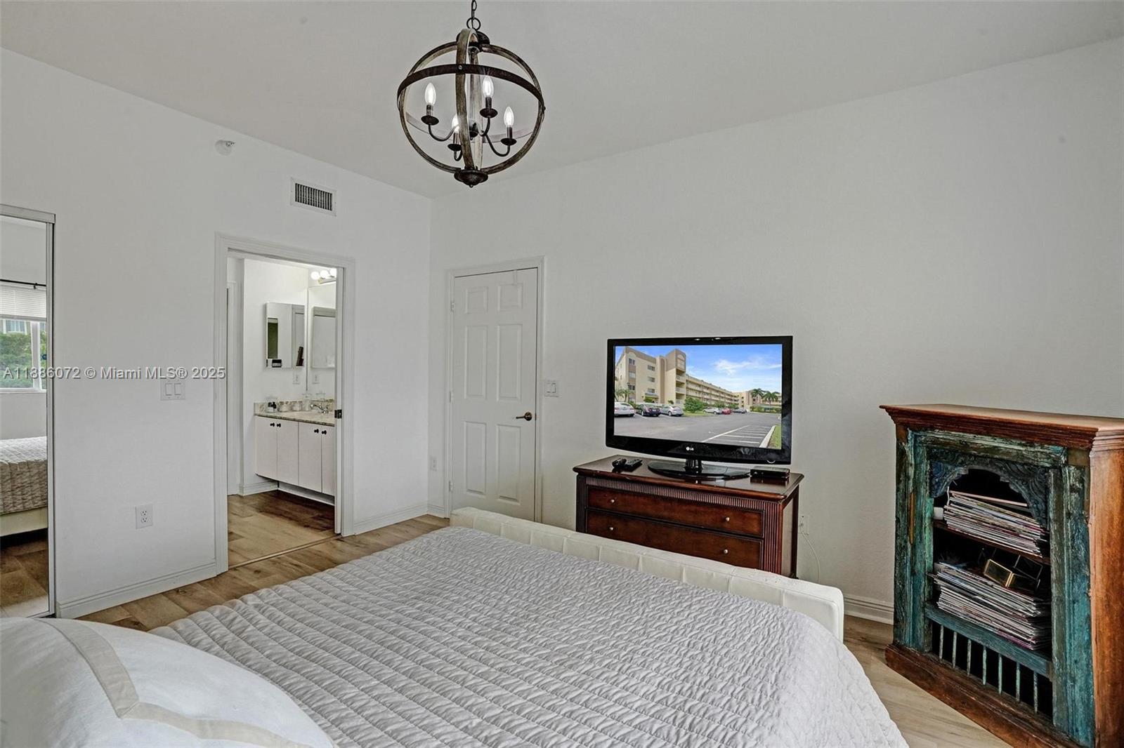 7635 Southampton Terrace, Unit 307 Tamarac, FL 33321 - Photo 27 of 43 a bedroom with bed and furniture