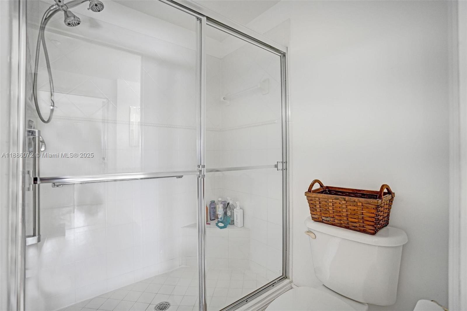 7635 Southampton Terrace, Unit 307 Tamarac, FL 33321 - Photo 30 of 43 a bathroom with a shower a toilet and a sink