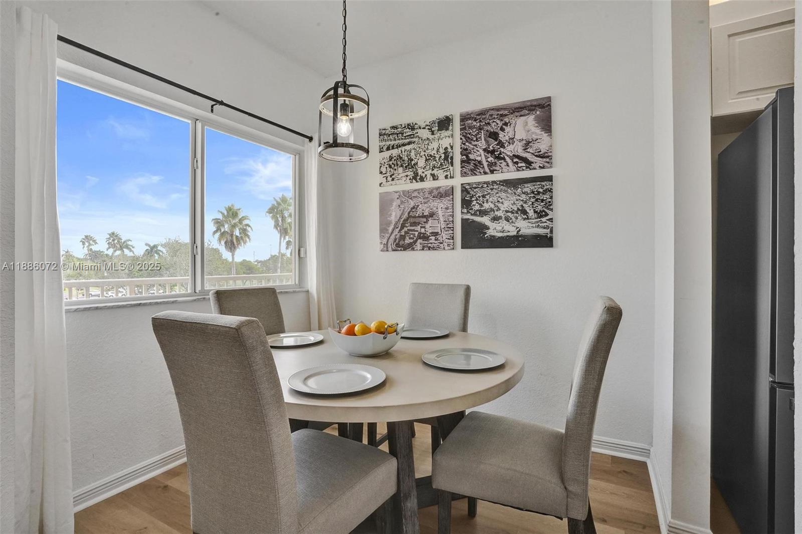 7635 Southampton Terrace, Unit 307 Tamarac, FL 33321 - Photo 3 of 43 a view of a dining room with furniture window and outside view