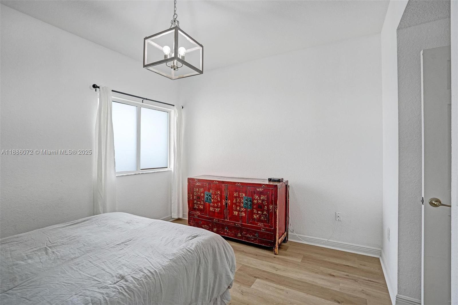 7635 Southampton Terrace, Unit 307 Tamarac, FL 33321 - Photo 32 of 43 a room with bed and a window