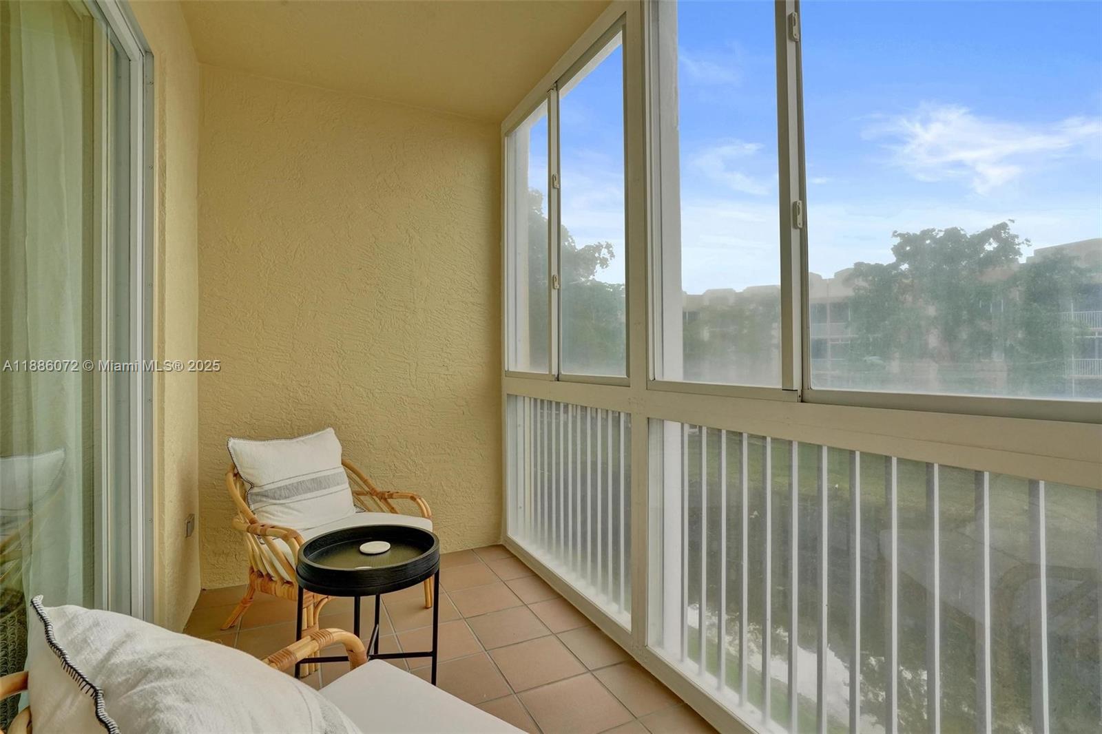 7635 Southampton Terrace, Unit 307 Tamarac, FL 33321 - Photo 38 of 43 a view of a balcony with furniture