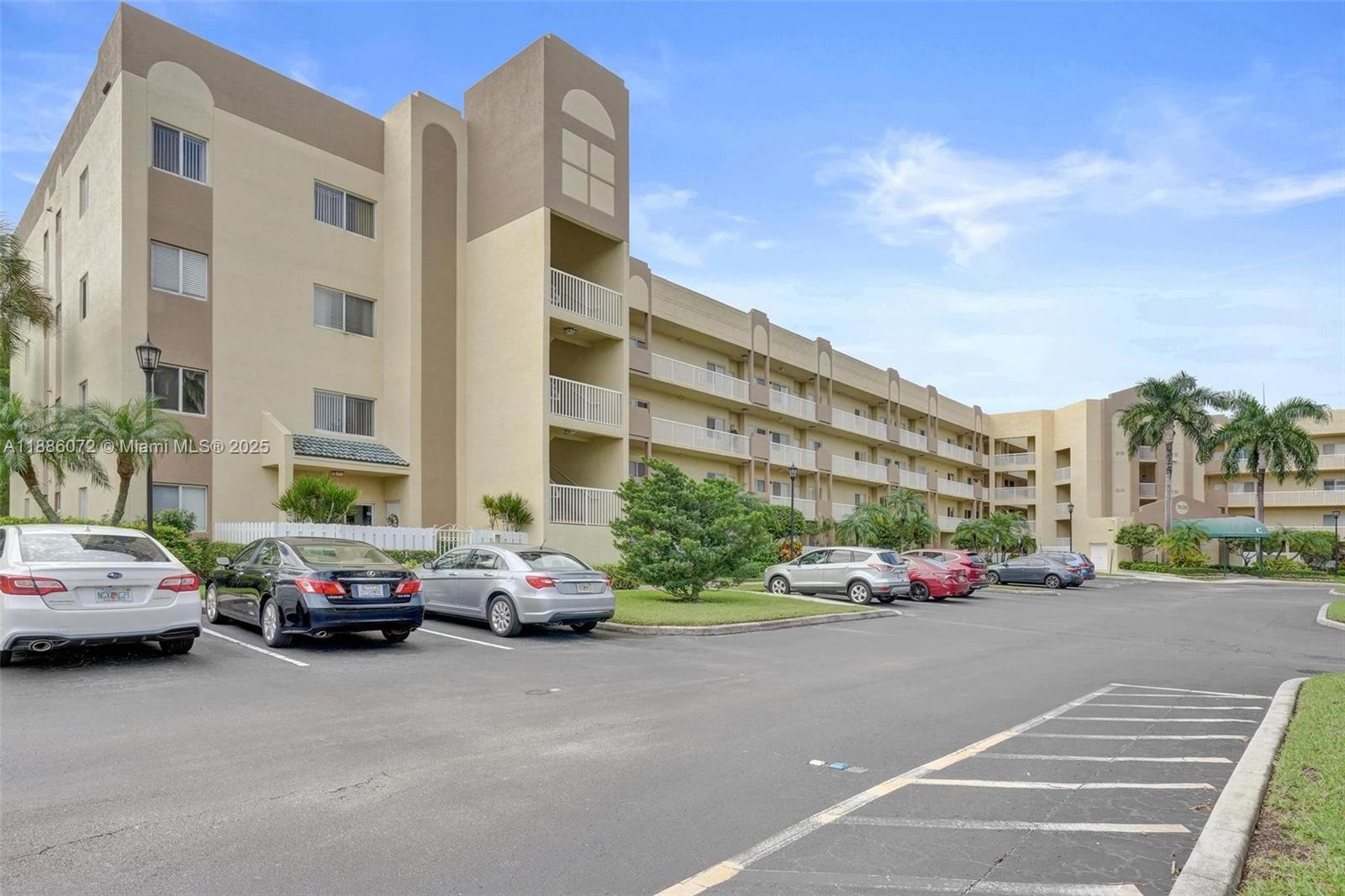 7635 Southampton Terrace, Unit 307 Tamarac, FL 33321 - Photo 40 of 43 a cars parked in front of a building