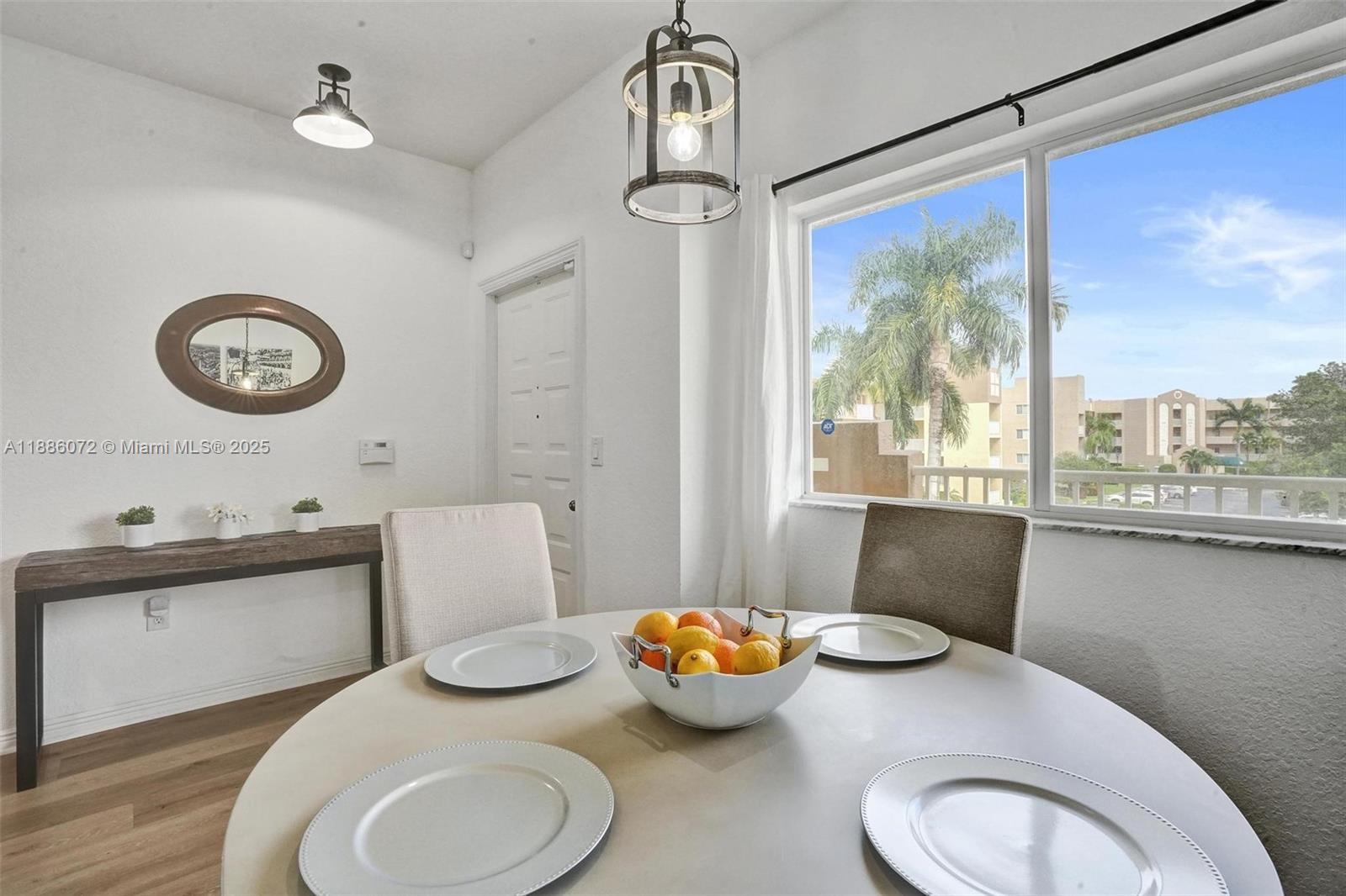 7635 Southampton Terrace, Unit 307 Tamarac, FL 33321 - Photo 4 of 43 a bathroom with a granite countertop toilet sink and mirror