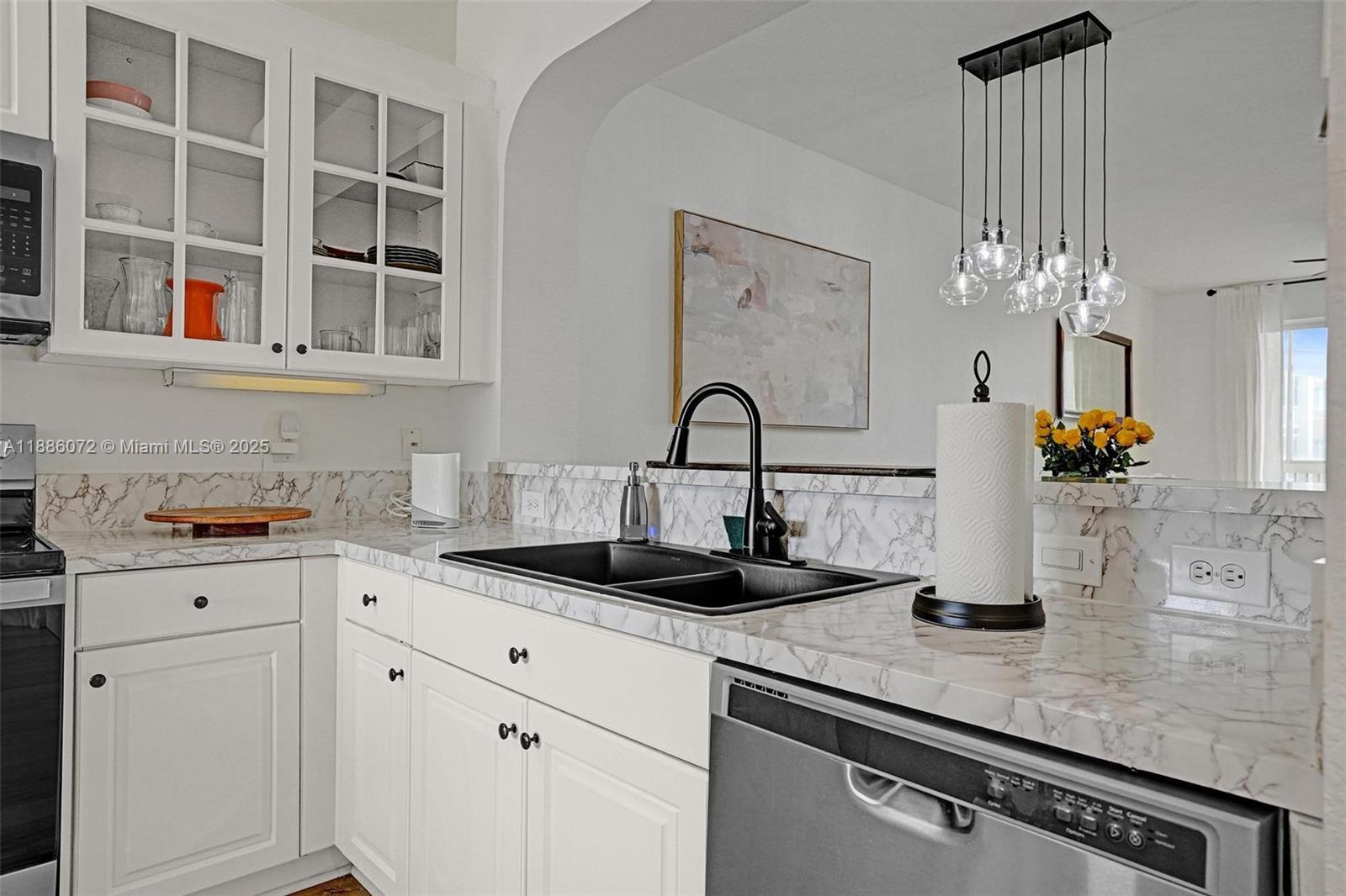 7635 Southampton Terrace, Unit 307 Tamarac, FL 33321 - Photo 8 of 43 a kitchen with a sink and cabinets