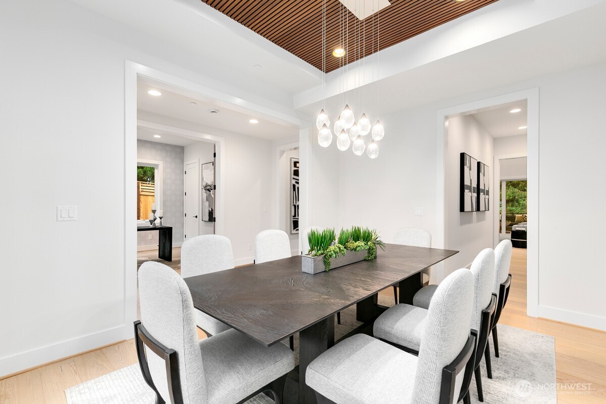 1455 153rd Place Southeast Bellevue, WA 98007 - Photo 16 of 39 a view of a dining room with furniture and wooden floor