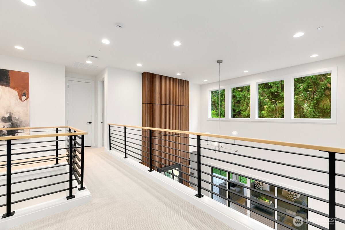 1455 153rd Place Southeast Bellevue, WA 98007 - Photo 20 of 39 a kitchen with stainless steel appliances kitchen island granite countertop a stove and a large window