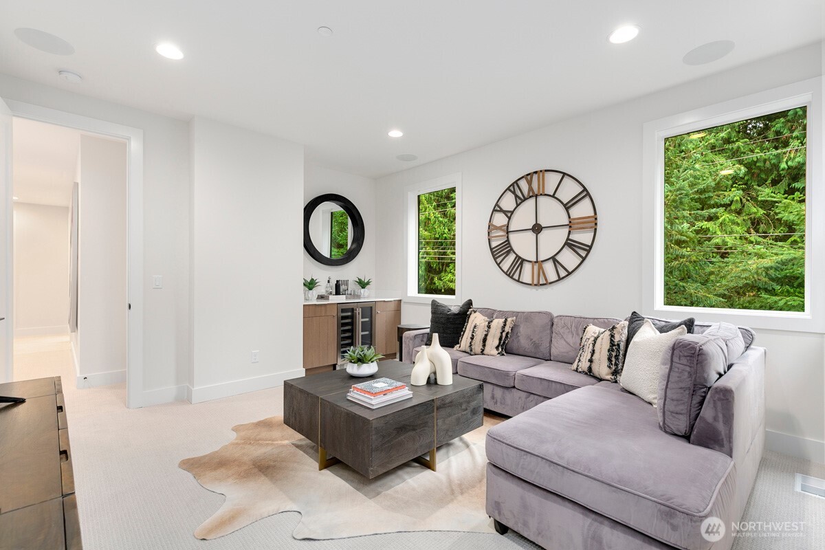 1455 153rd Place Southeast Bellevue, WA 98007 - Photo 22 of 39 a living room with furniture a clock and a window