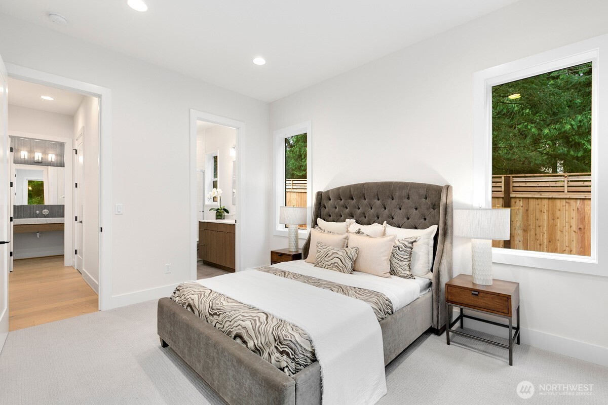 1455 153rd Place Southeast Bellevue, WA 98007 - Photo 28 of 39 a bedroom with a large bed and a window