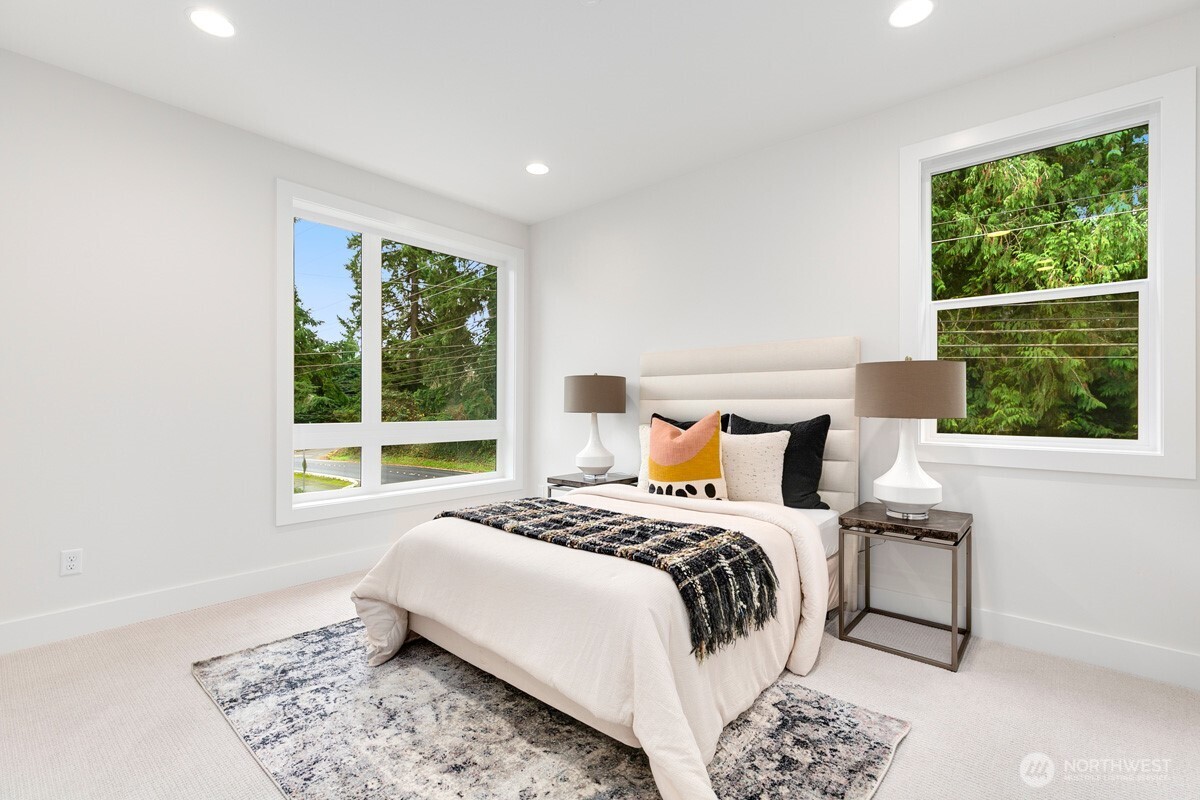 1455 153rd Place Southeast Bellevue, WA 98007 - Photo 30 of 39 a bedroom with a bed and a window