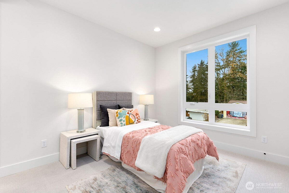 1455 153rd Place Southeast Bellevue, WA 98007 - Photo 31 of 39 a bedroom with a bed and a large window