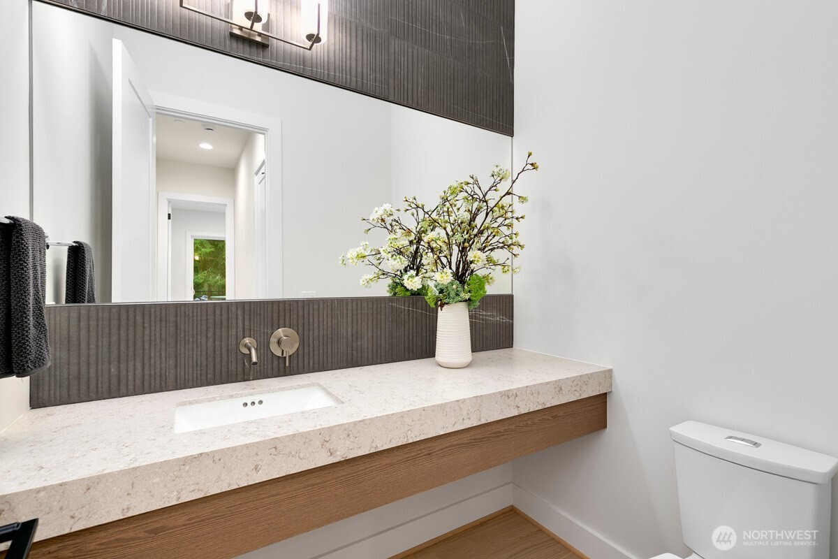 1455 153rd Place Southeast Bellevue, WA 98007 - Photo 34 of 39 a bathroom with a granite countertop sink and a mirror