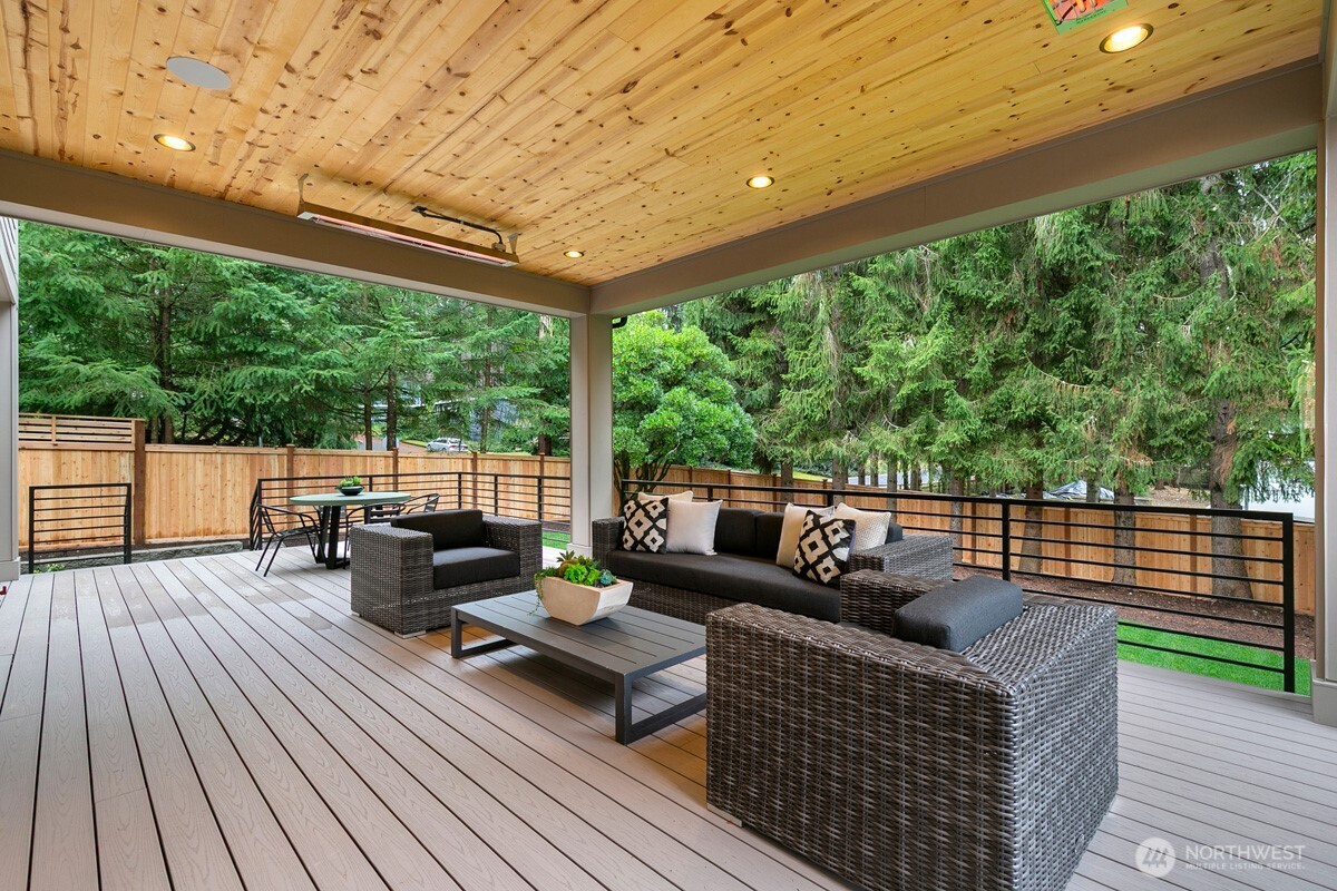 1455 153rd Place Southeast Bellevue, WA 98007 - Photo 38 of 39 a view of a patio with couches chairs and wooden floor