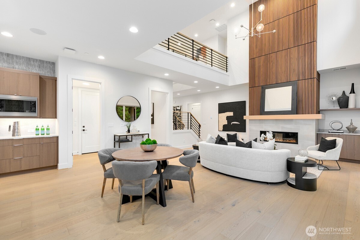 1455 153rd Place Southeast Bellevue, WA 98007 - Photo 5 of 39 a living room with fireplace furniture and a flat screen tv