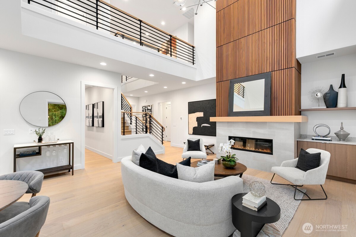 1455 153rd Place Southeast Bellevue, WA 98007 - Photo 6 of 39 a living room with furniture potted plant and a fireplace