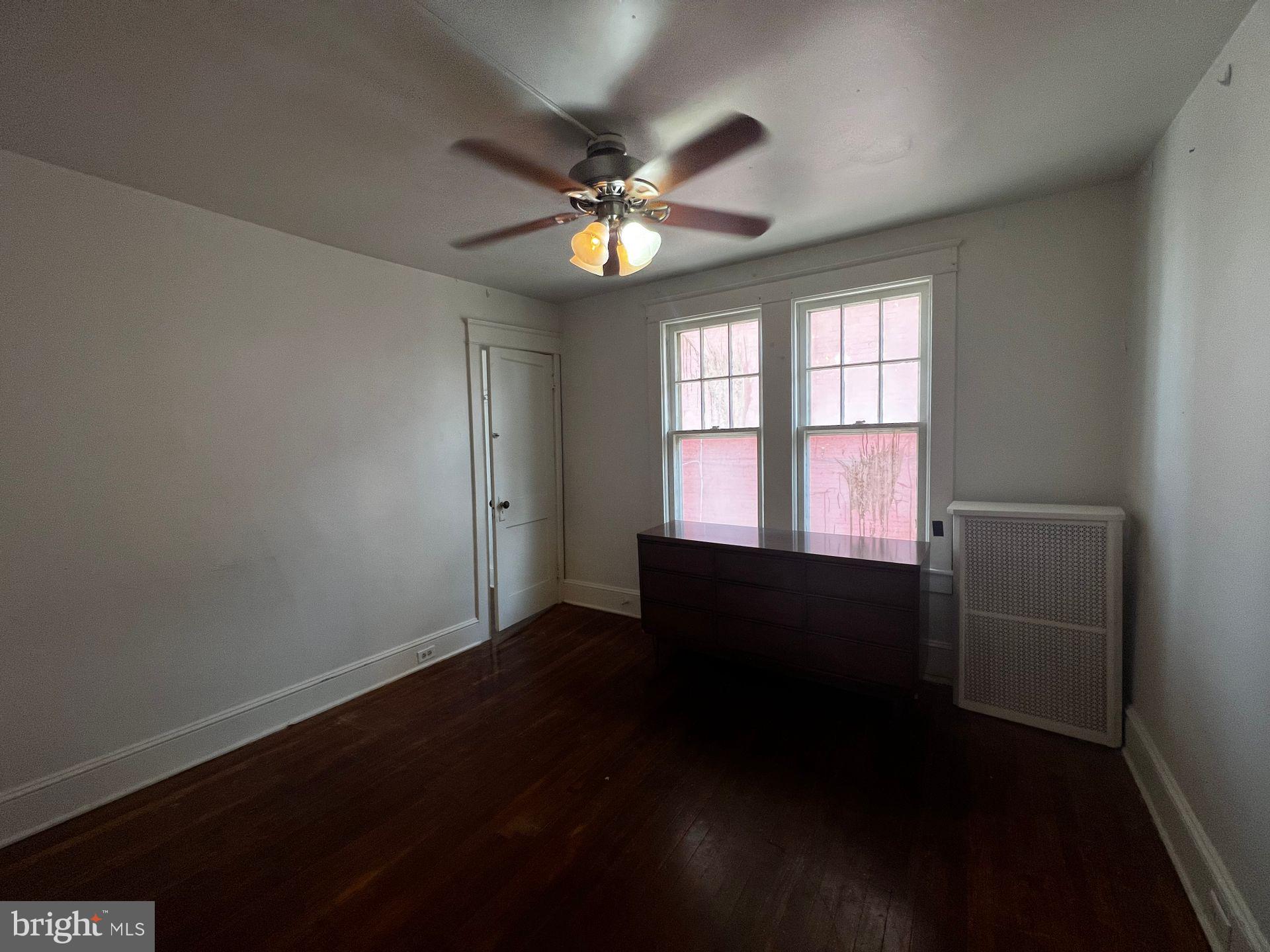 310 West Jackson Street York, PA 17401 - Photo 3 of 13 wooden floor in an empty room with a window