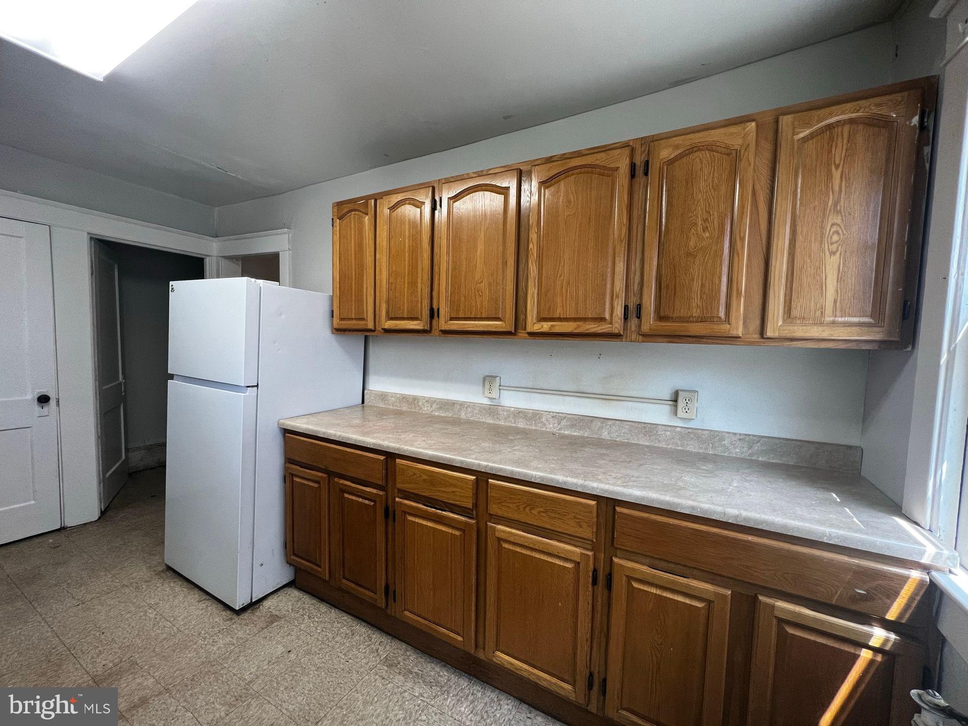 310 West Jackson Street York, PA 17401 - Photo 4 of 13 a kitchen with stainless steel appliances granite countertop a refrigerator sink and cabinets