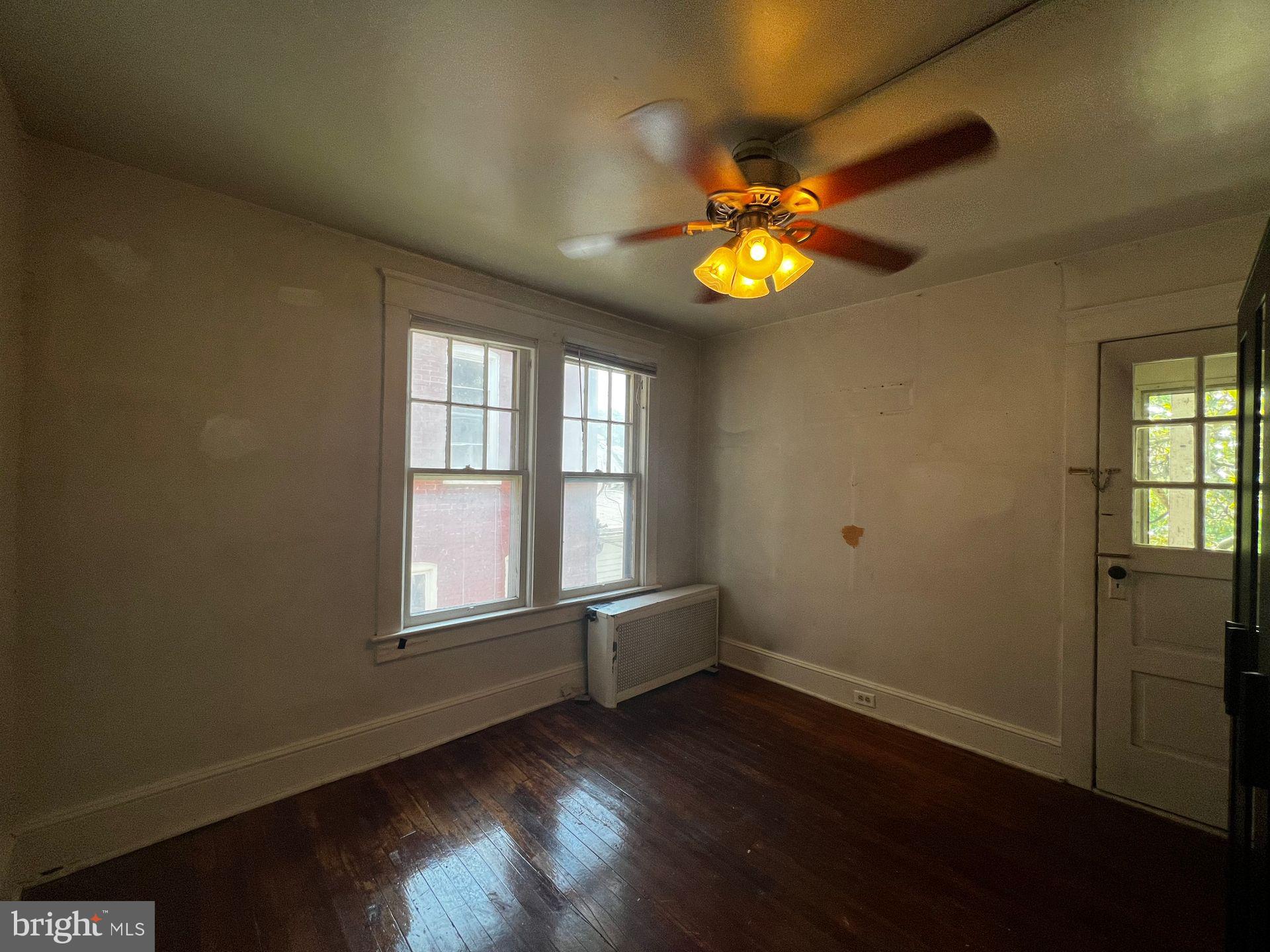310 West Jackson Street York, PA 17401 - Photo 5 of 13 a view of empty room with wooden floor and fan