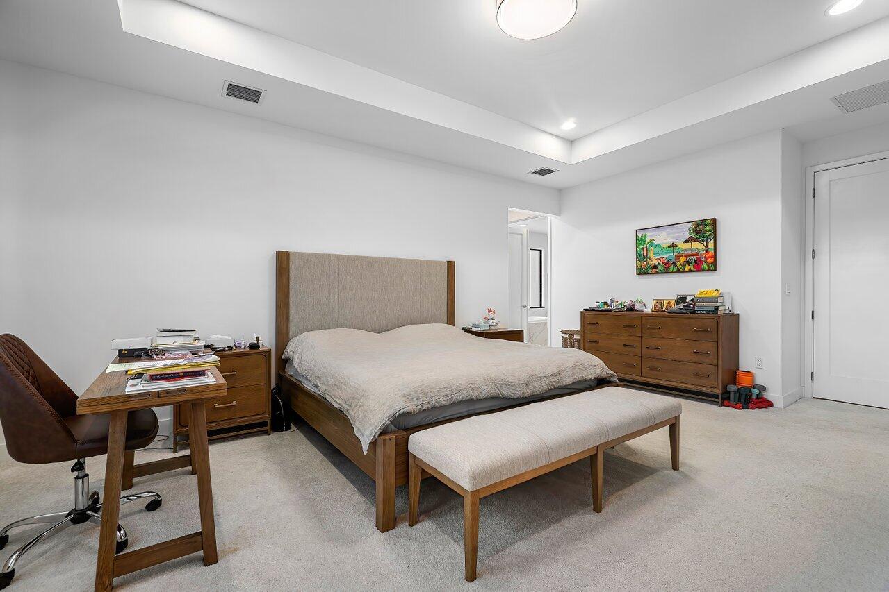 17092 Teton River Road Boca Raton, FL 33496 - Photo 12 of 58 a bedroom with a bed and a workspace