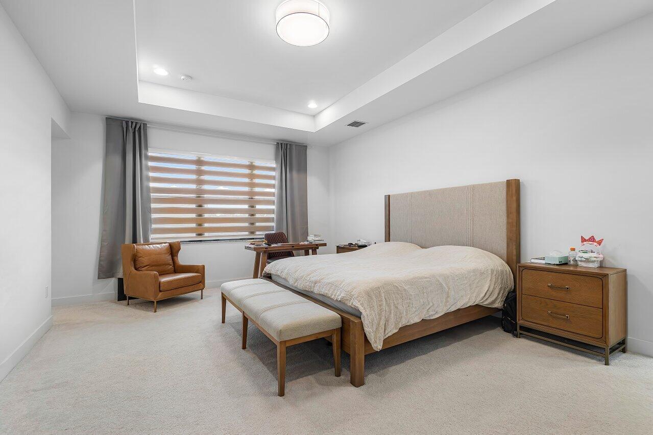 17092 Teton River Road Boca Raton, FL 33496 - Photo 13 of 58 a bedroom with a bed and a couch