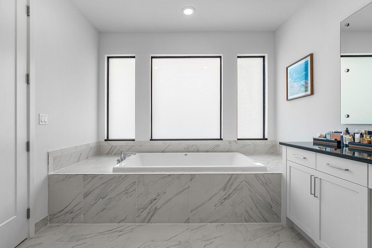 17092 Teton River Road Boca Raton, FL 33496 - Photo 14 of 58 a bathroom with a bathtub and a sink