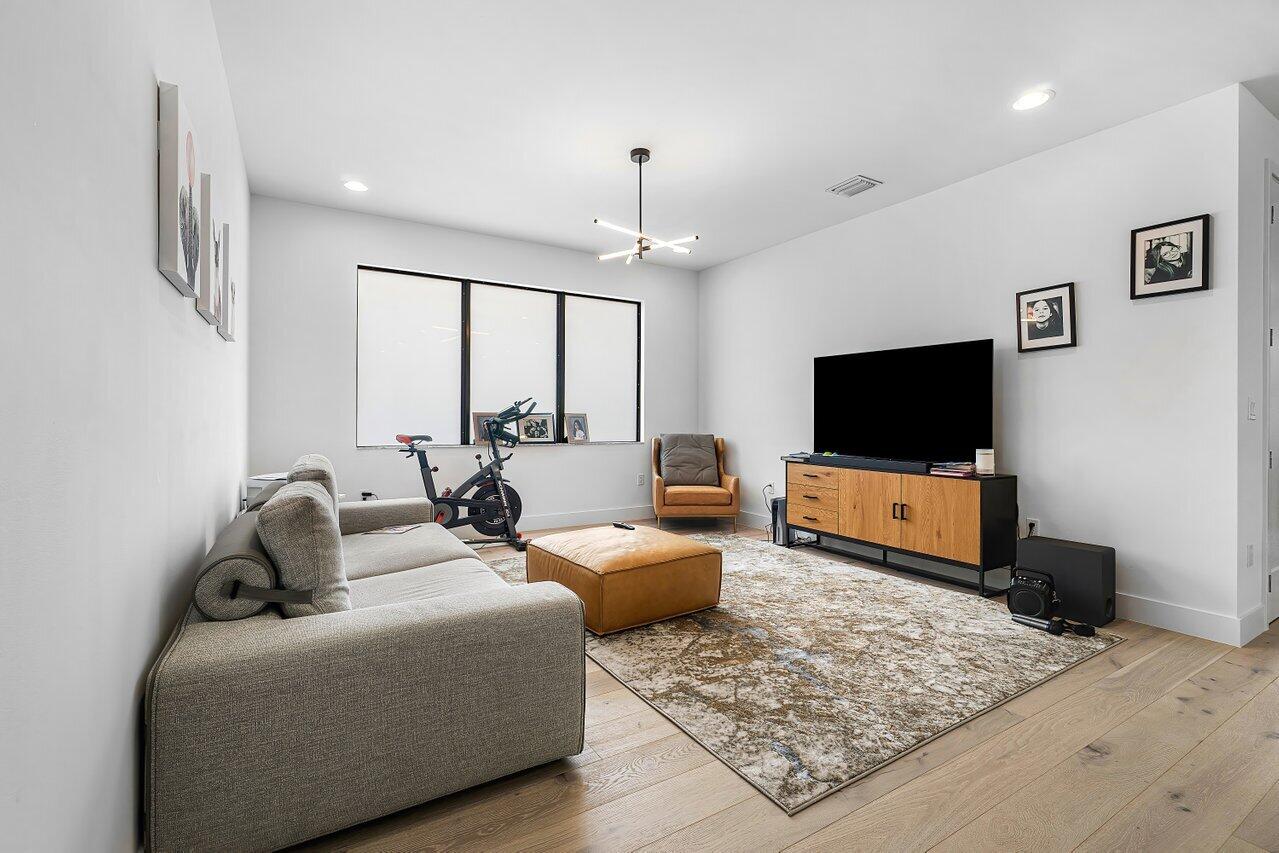 17092 Teton River Road Boca Raton, FL 33496 - Photo 21 of 58 a living room with furniture and a flat screen tv