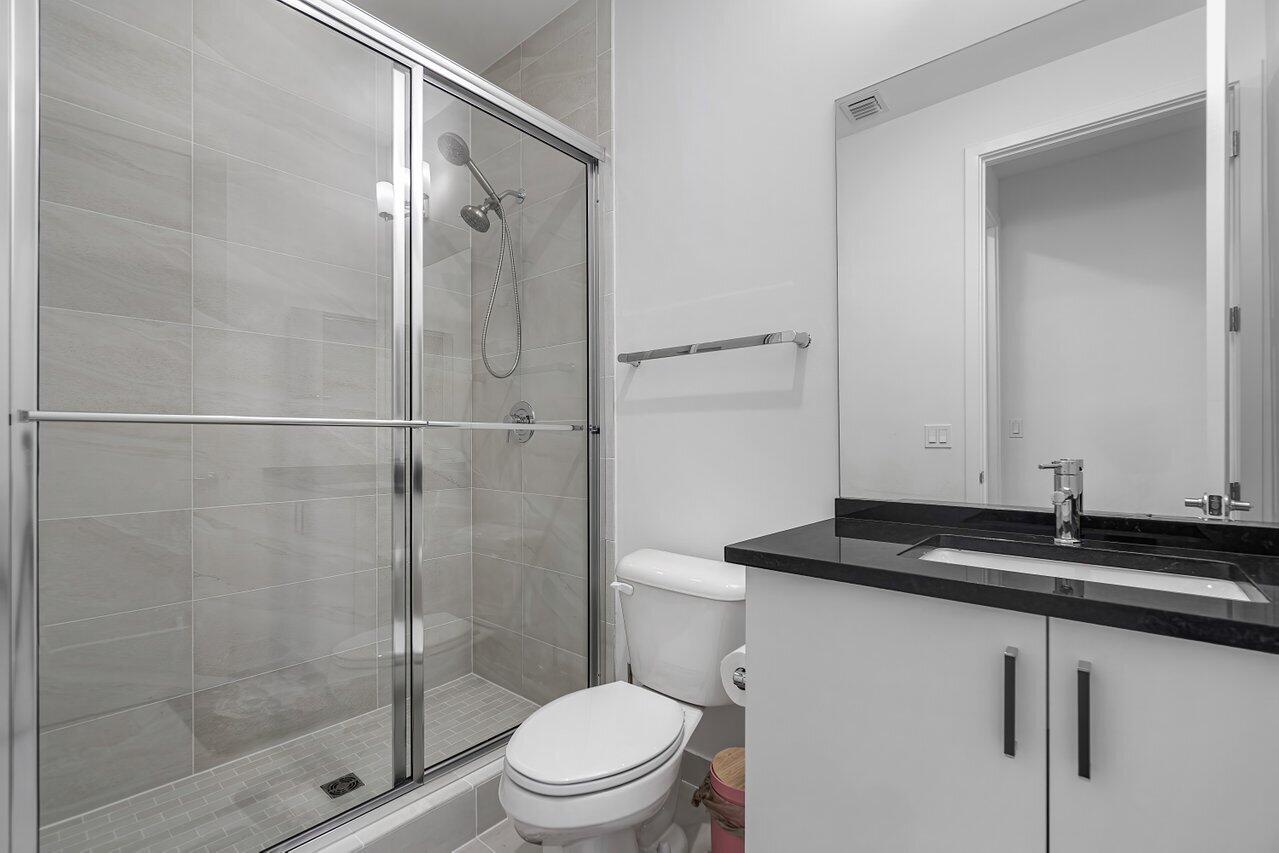 17092 Teton River Road Boca Raton, FL 33496 - Photo 25 of 58 a bathroom with a sink a toilet and shower