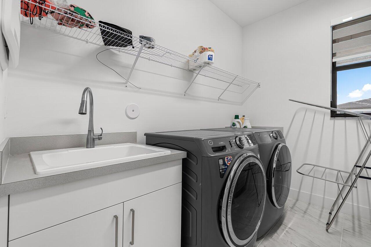 17092 Teton River Road Boca Raton, FL 33496 - Photo 28 of 58 a utility room with dryer and washer