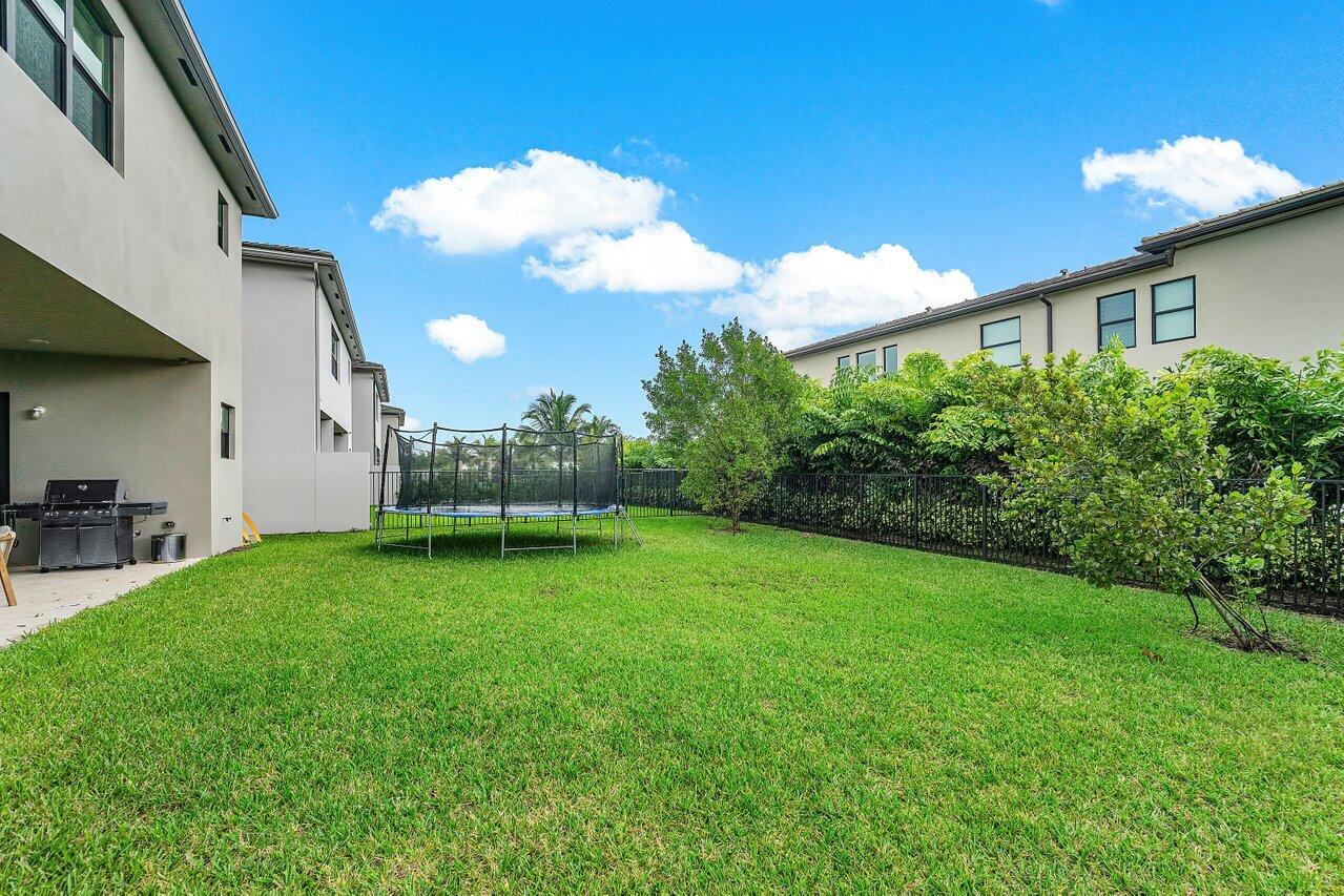 17092 Teton River Road Boca Raton, FL 33496 - Photo 32 of 58 a view of a backyard with plants and a garden
