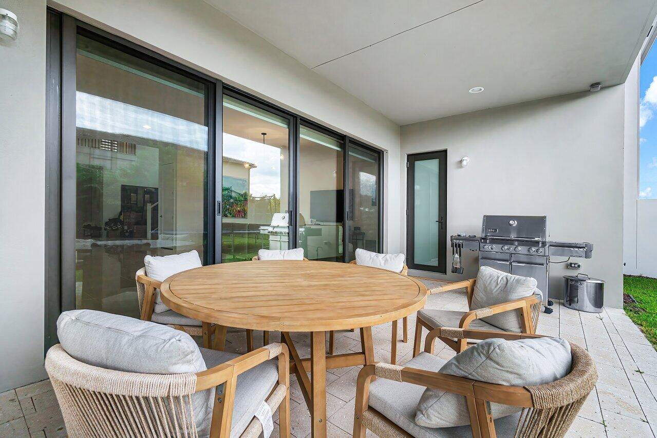 17092 Teton River Road Boca Raton, FL 33496 - Photo 34 of 58 a view of a dining room with furniture window and outside view