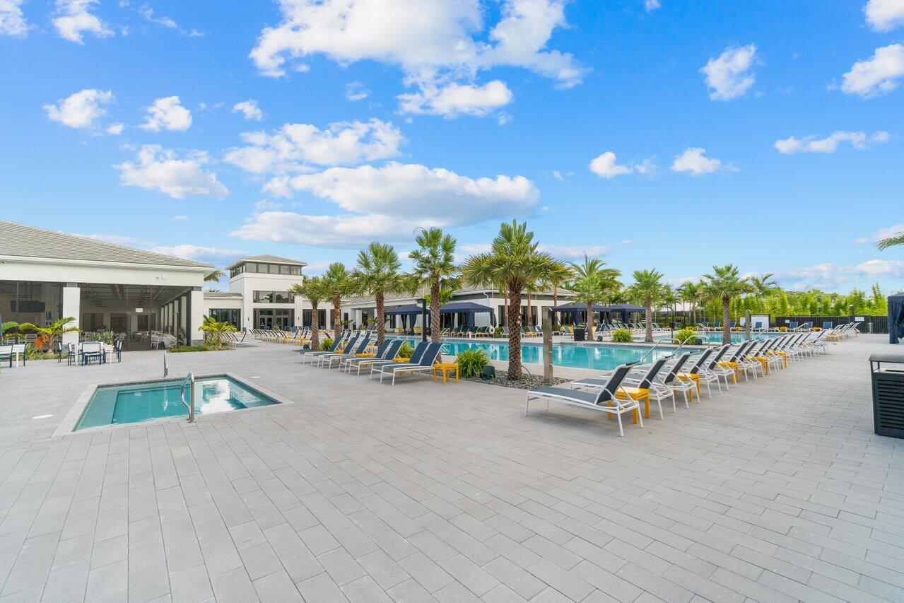 17092 Teton River Road Boca Raton, FL 33496 - Photo 43 of 58 a view of a swimming pool with lawn chairs and couches